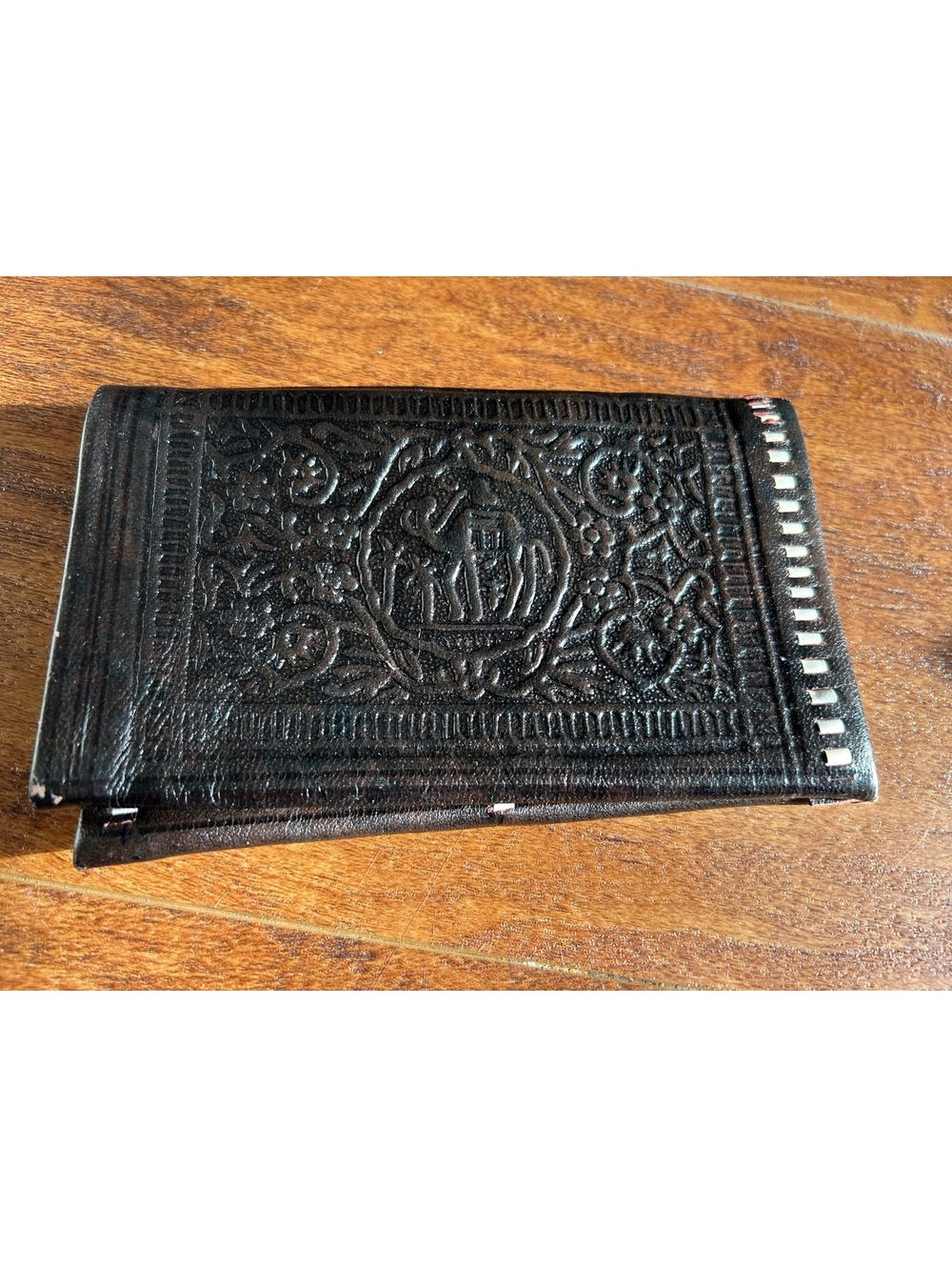 Vintage Embossed Black Leather Wallet with Intricate Design